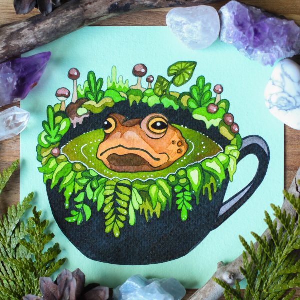 Swamp Tea printti. Sammakko istuu teekupissa.